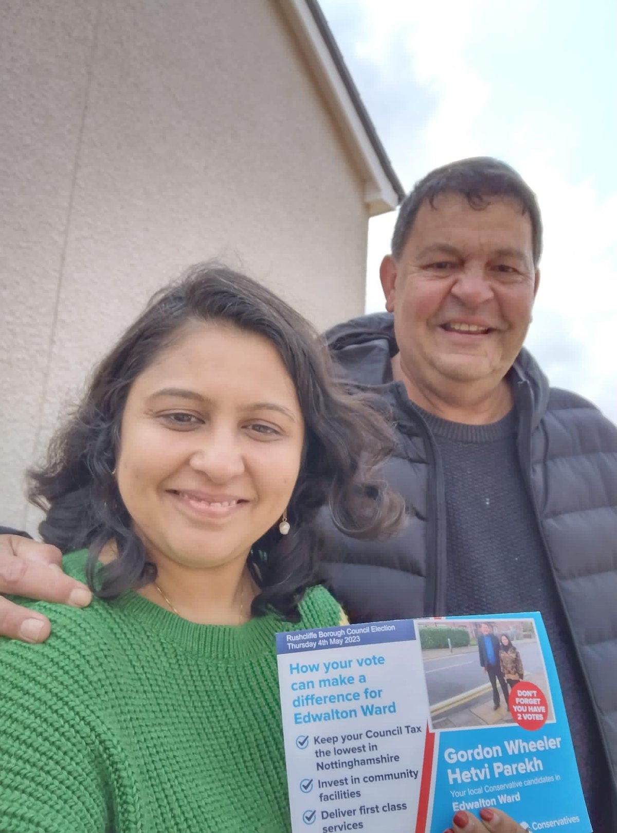 Hetvi Parekh poses with a man while campaigning.